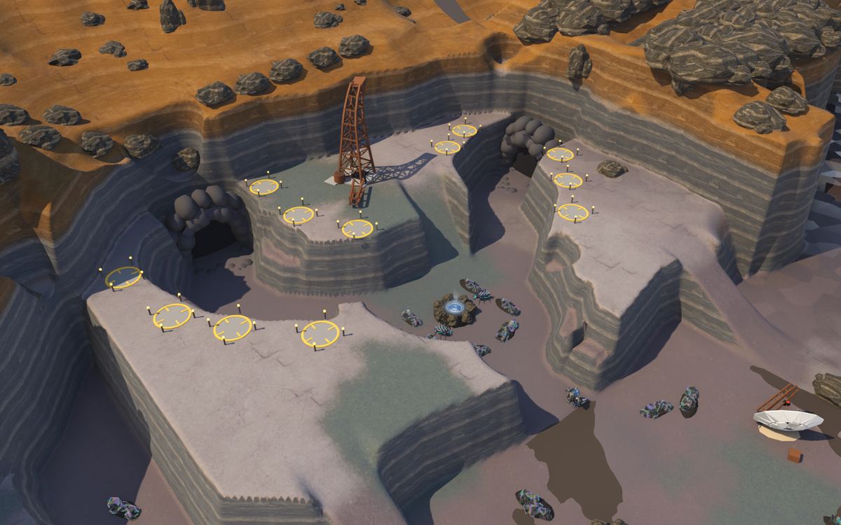 The Fork from above: a mesa cut by two winding canyon arms that meet at a basin with deposits round a well, yellow build spots along the rims, the old derrick ruin between the arms